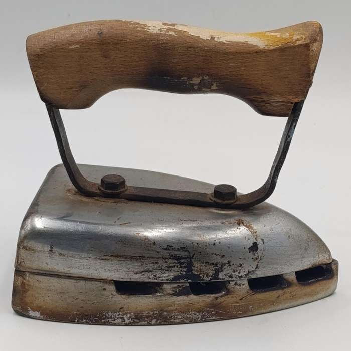 Vintage gas heated sad iron with heating stand