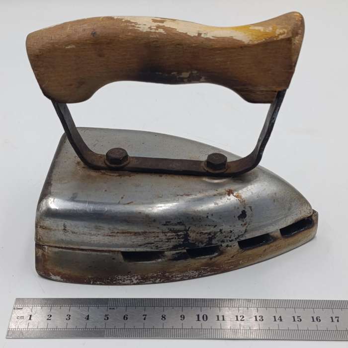 Vintage gas heated sad iron with heating stand