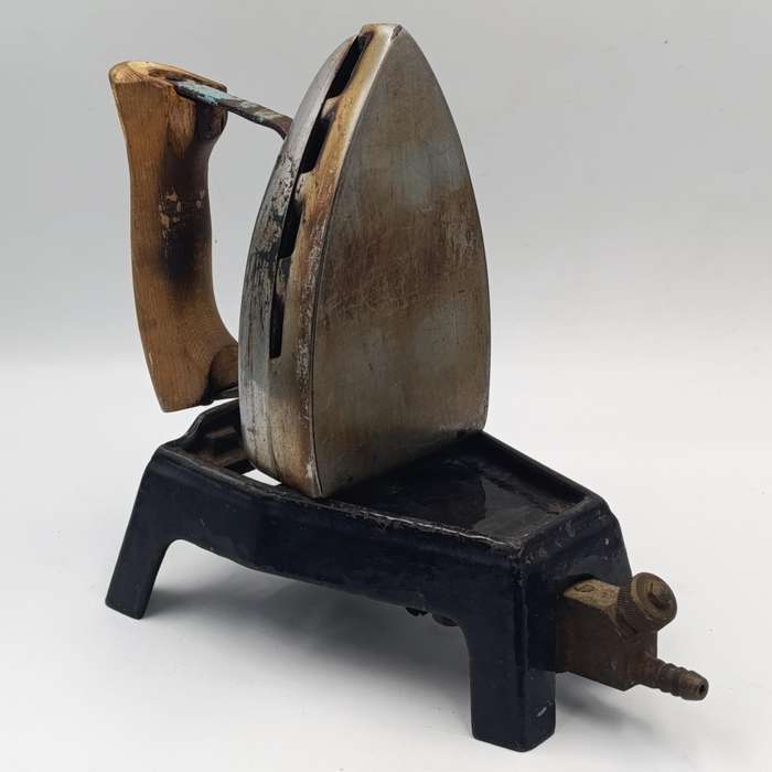 Vintage gas heated sad iron with heating stand