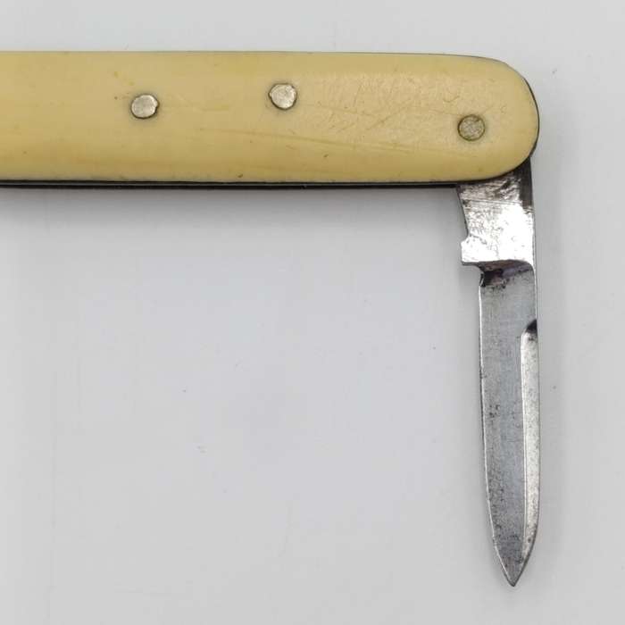Vintage miniature pocket knife with bootlace puller