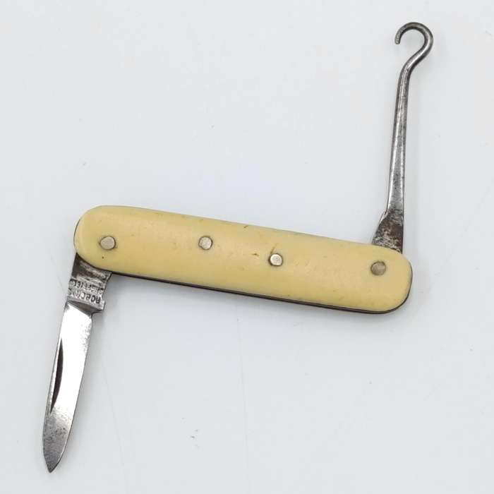 Vintage miniature pocket knife with bootlace puller
