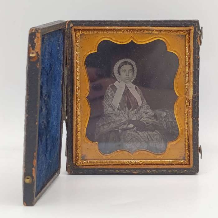 Antique photo frame case with gilt decor and photo of lady