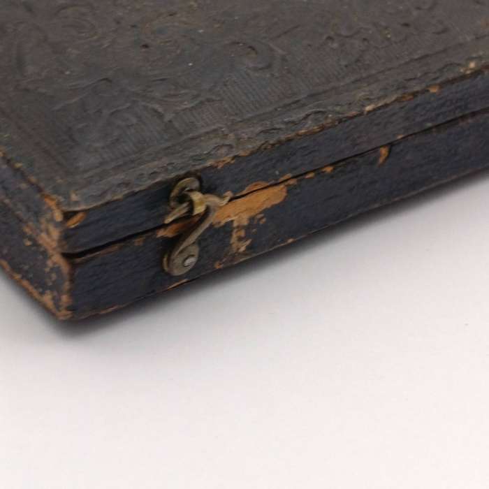 Antique photo frame case with gilt decor and photo of lady