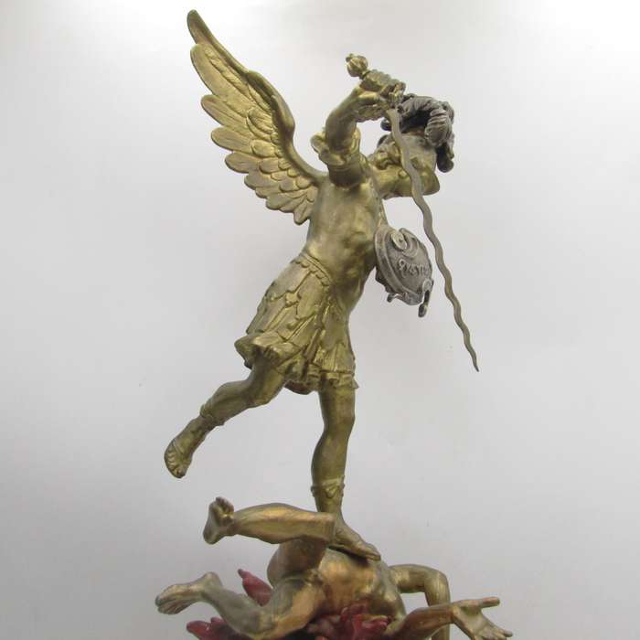 Vintage Large bronze statue of Archangel Michael casting the devil and demons into hell.