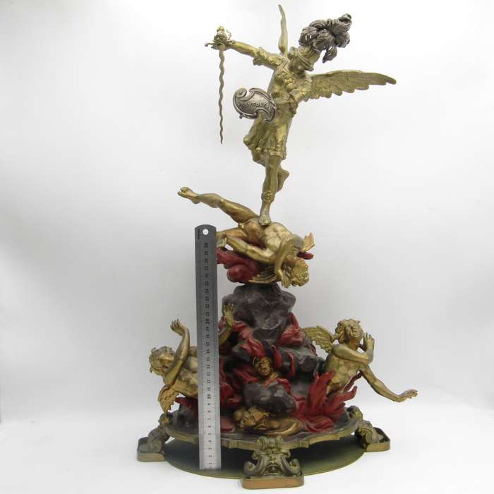 Vintage Large bronze statue of Archangel Michael casting the devil and demons into hell.