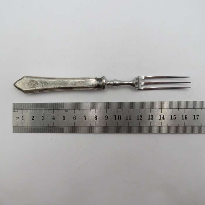 Antique pickle fork with ZAR Transvaal coat of arms on handle.