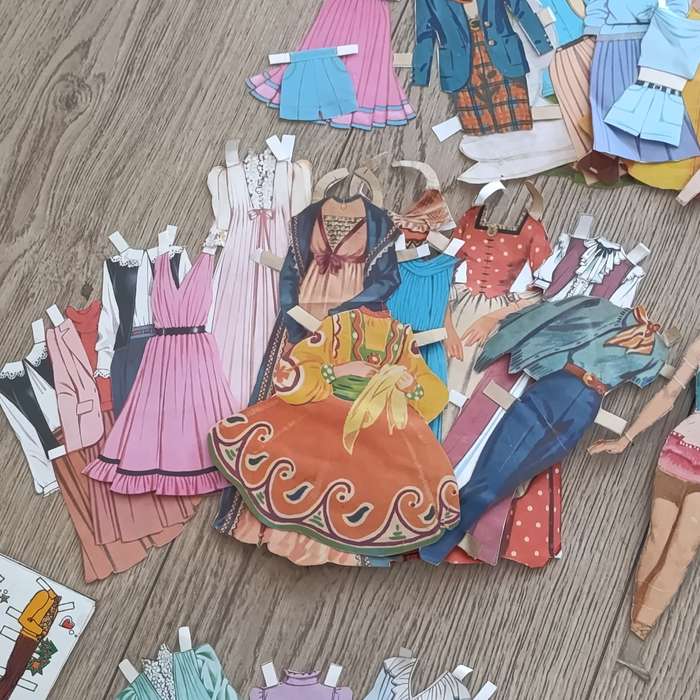 Large lot of vintage paper dolls with various dresses