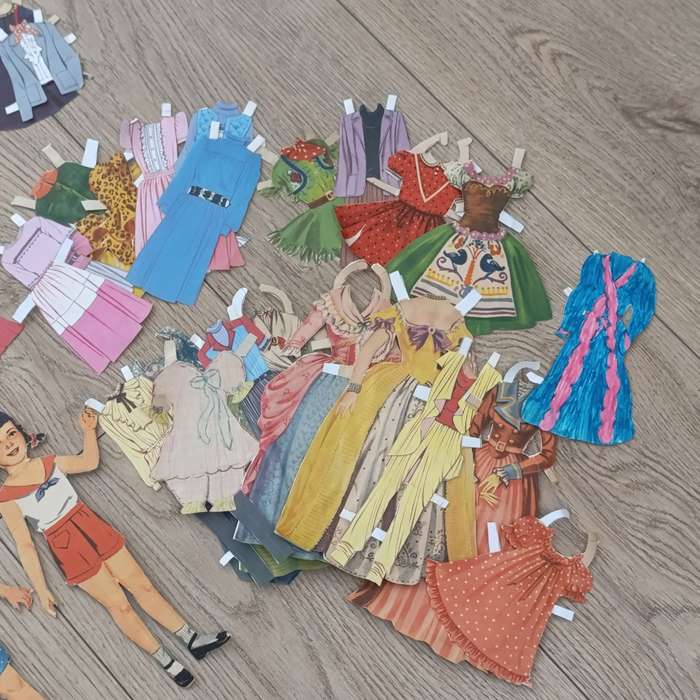 Large lot of vintage paper dolls with various dresses