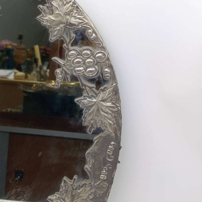 Antique oval mirror with grapevine pewter atrwork frame