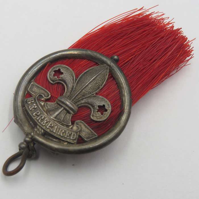 Antique silver scout badge - red plume