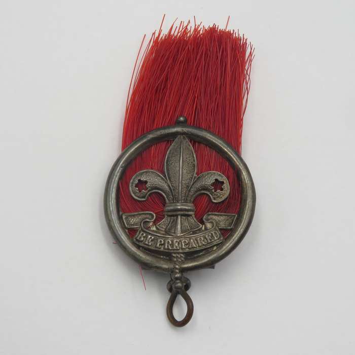 Antique silver scout badge - red plume