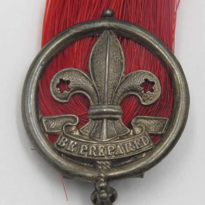 Antique silver scout badge - red plume