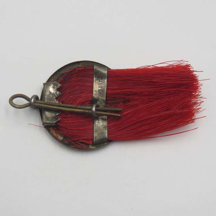 Antique silver scout badge - red plume