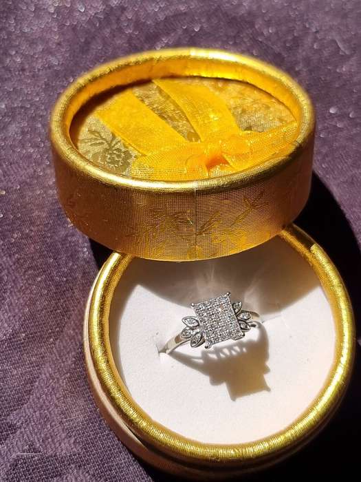 "0.15 CARAT" DIAMOND CLUSTER RING" Set in 9 Carat White Gold. ( Genuine Gold.)