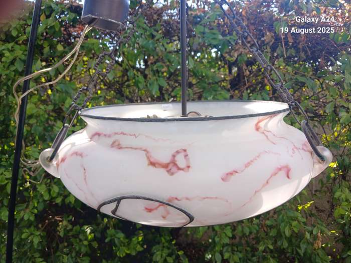 A hanging opaque glass marbled light