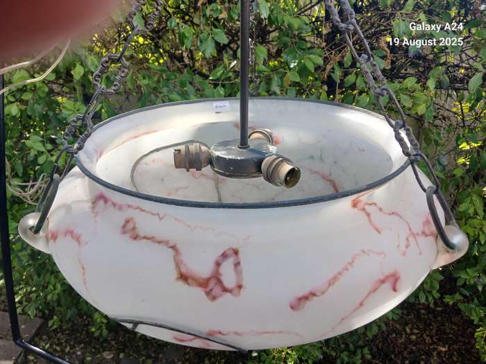 A hanging opaque glass marbled light