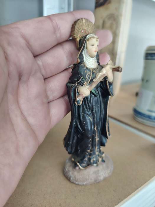 statue of Saint Rita of Cascia, a popular Catholic saint known as the patroness of impossible causes