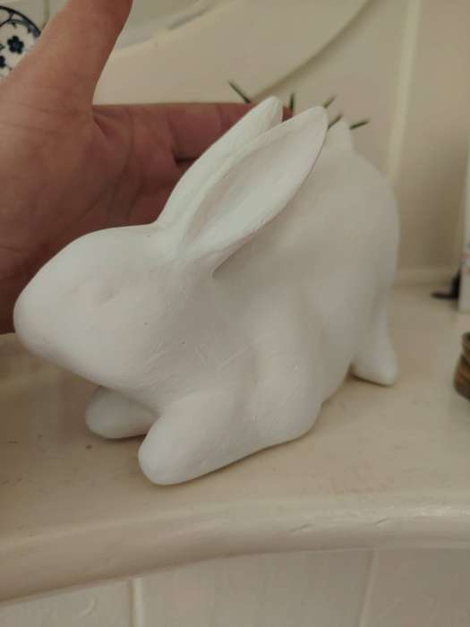 Beautiful clay crouching bunny ornament