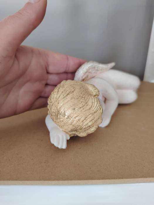 Beautiful sleeping cherub ceramic