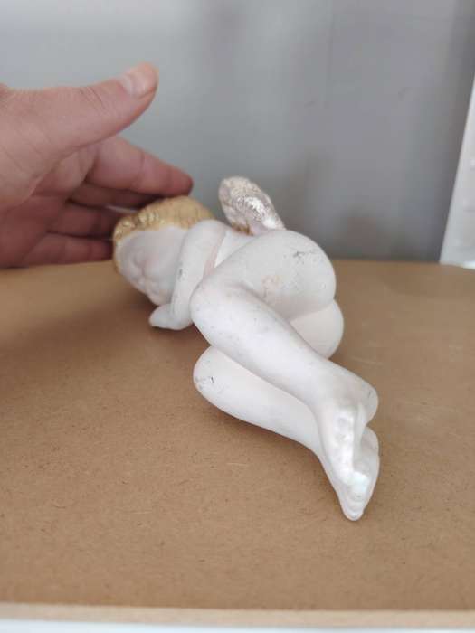 Beautiful sleeping cherub ceramic