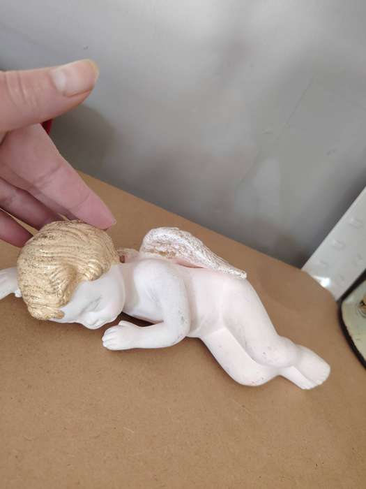 Beautiful sleeping cherub ceramic