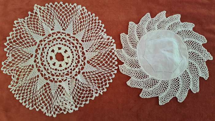 Two unusual, white, crochet doilies 20cm and 25cm
