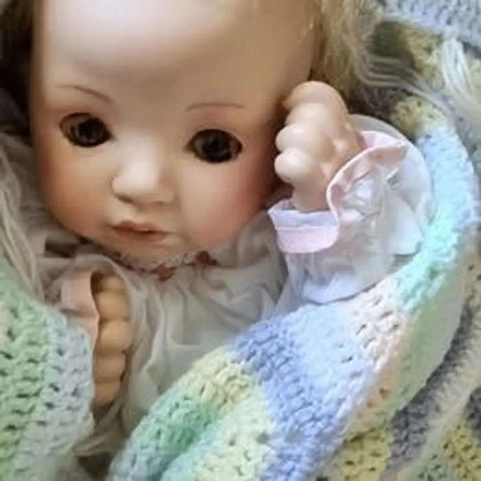 Sweet happy porcelain baby girl doll