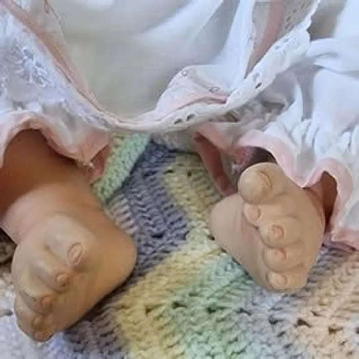 Sweet happy porcelain baby girl doll