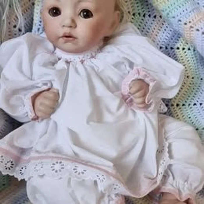 Sweet happy porcelain baby girl doll