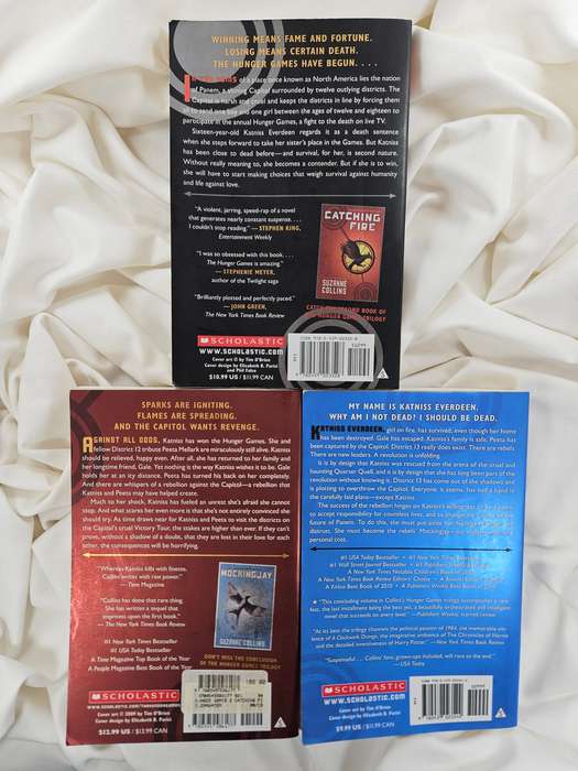 The Hunger Games Trilogy (Hunger Games, Catching Fire & Mockingjay) by Suzanne Collins - Paperback