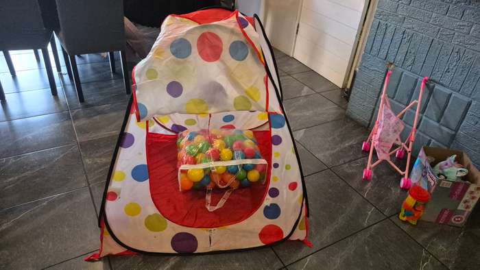 Pop-up Tent and plastic balls.
