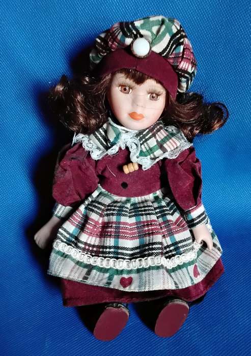 Small Vintage Porcelain Doll in sitting Position