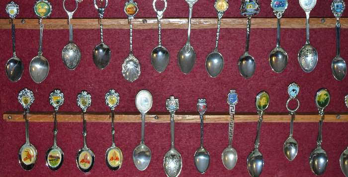 Large Collection of  Vintage Souvenir / Collectable Spoons in Display Case