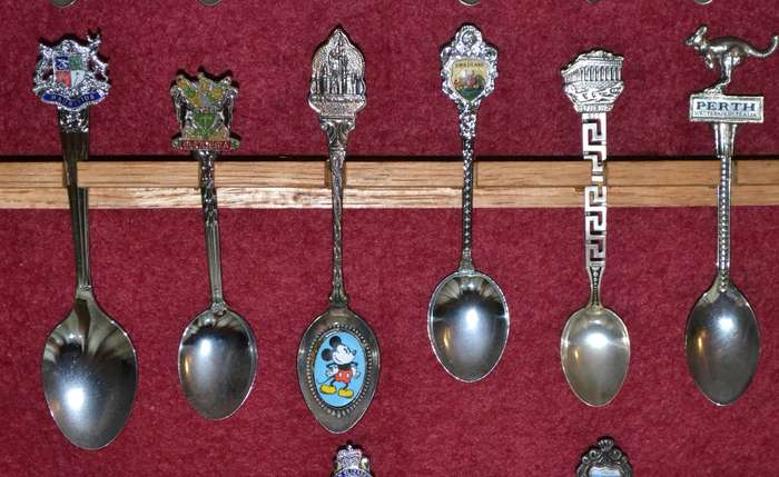 Collection of  Vintage Souvenir / Collectable Spoons in Display Case