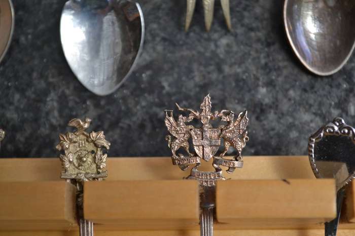 Collectable vintage Charm Style Handle Spoons in wooden Display Rack - 24 Spoons