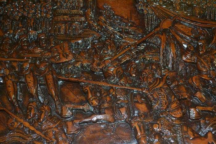 Chinese Oval Vintage Coffee Table with Carved Battle Scene under fixed glass top