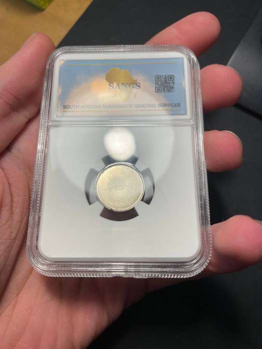 Blank nickel 5 cent (1965-1989) graded by SANGS - holder damaged