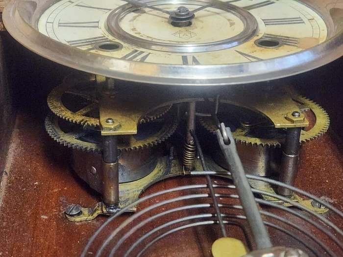 Vintage Ansonia Wall Clock in an Ornate Oak Casing