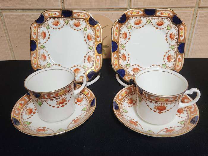 PAIR OF ROYAL VALE COLCLOUGH IMARI STYLE BONE CHINA TEA TRIOS
