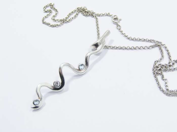 A Beautiful Swirl Design Zirconia Pendant on Chain in Sterling Silver.