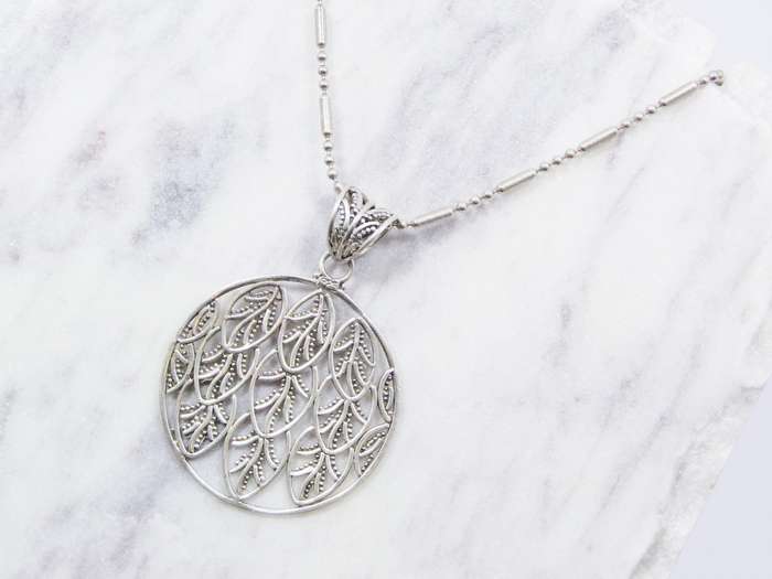 A Beautiful Large Round Leaf Design Pendant on Chain in Sterling Silver.