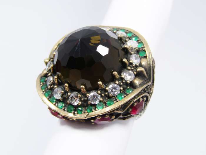 A Gorgeous Huge Facetted Smokey Color Crystal Surrounded With Pink Green and Clear Crystals in Sterl
