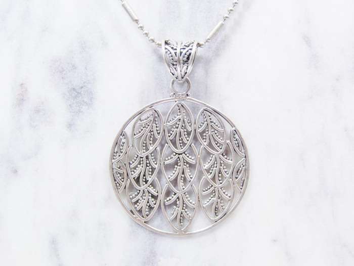 A Beautiful Large Round Leaf Design Pendant on Chain in Sterling Silver.