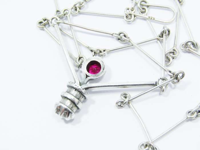 A Stunning Weighty Red Paste Stone Necklace in Sterling Silver