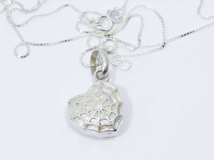 A Beautiful Spider Web Heart Locket Pendant on Chain in Sterling Silver.