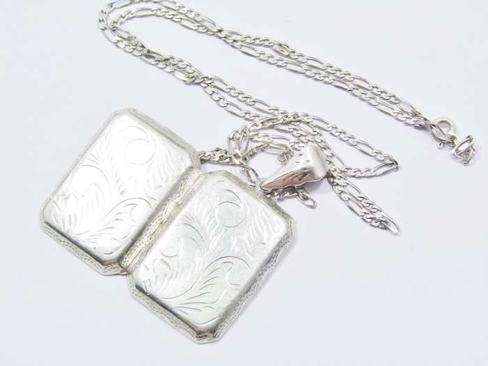 A Gorgeous Large Rectangular Engraved Locket On Chain in Sterling Silver.