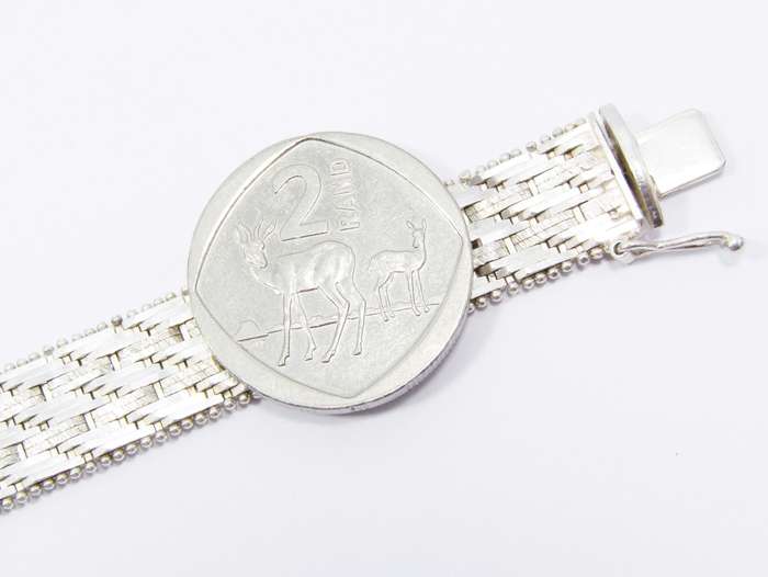 A Stunning Broad Articulated Woven Bracelet in Sterling Silver.