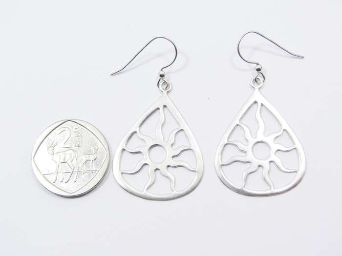 A Beautiful Pair of Cut out Sun Design Dangling Earring in Sterling Silver.