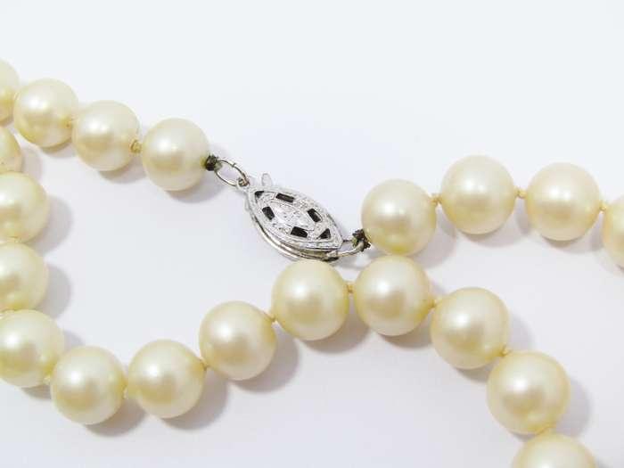 A Lovely String of  Vintage Faux Pearls with a Sterling Silver Clasp