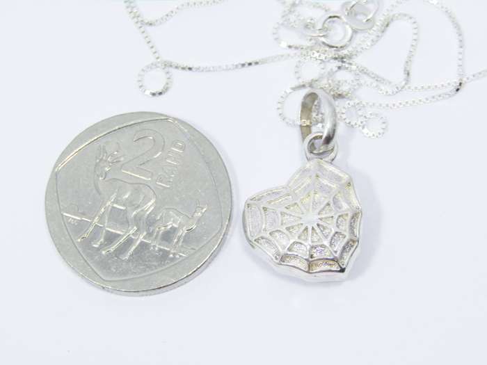 A Beautiful Spider Web Heart Locket Pendant on Chain in Sterling Silver.